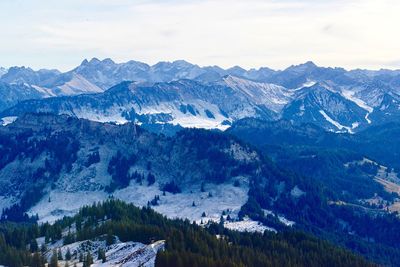 Scenic view of snowcapped mountains against sky