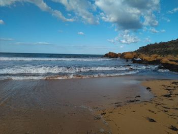 Scenic view of beach against sky