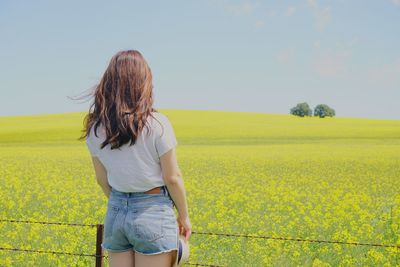 Rear view of woman in the countryside