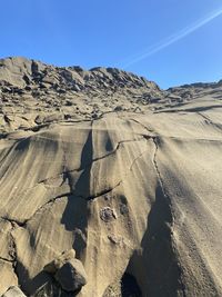 Shadow of man on arid landscape