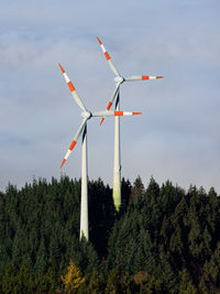 Low angle view of windmill against sky