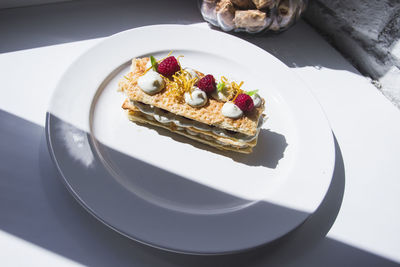 High angle view of cake in plate on table