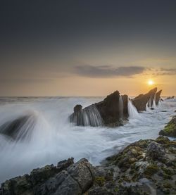 Scenic view of sea against sky during sunset