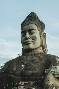 Low angle view of statue against sky