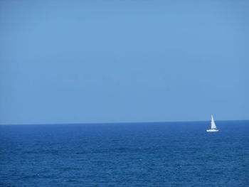 View of calm blue sea against clear sky