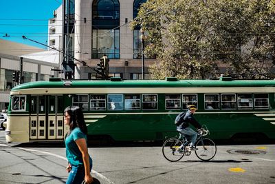 Woman riding bicycle on street