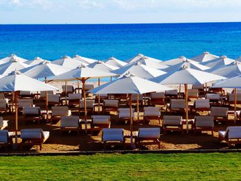 Scenic view of beach against blue sky