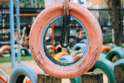 Close-up of chain swing hanging in park