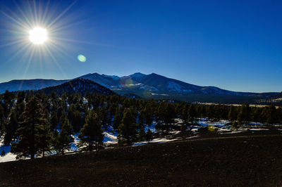 Scenic view of mountains against cloudy sky