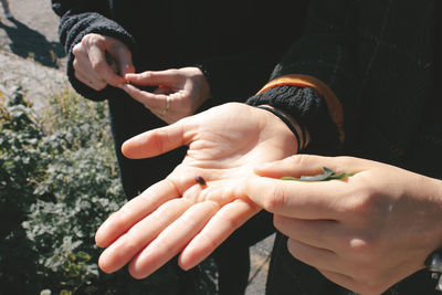 Close-up of man holding hands