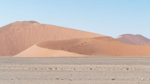 Scenic view of desert against clear sky