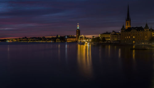 Illuminated buildings at waterfront