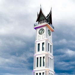 Low angle view of clock tower against sky