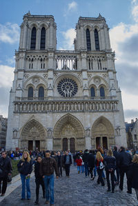 Tourists in front of building