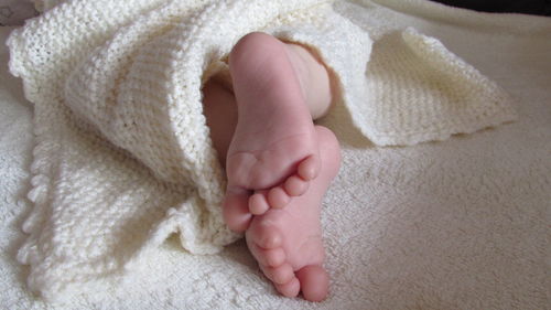 Low section of child feet on rug