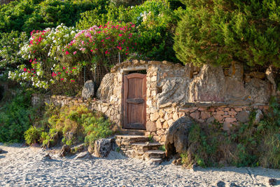 A beautiful wooden door is the private entrance to the beach