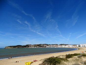 View of beach against blue sky
