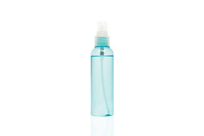 Close-up of blue bottle against white background