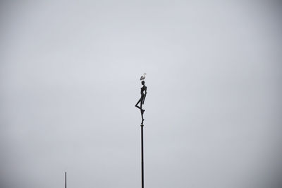 Low angle view of street light against clear sky