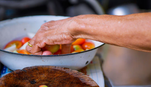 Close-up of man preparing food