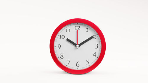 Close-up of clock against white background