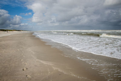 Scenic view of beach against sky