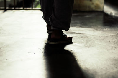 Low section of woman standing on floor