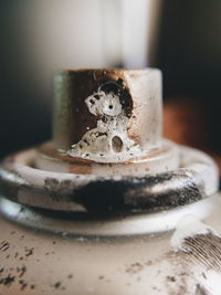 Close-up of figurine on table