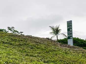 View of road sign against sky