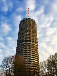 Low angle view of building against cloudy sky