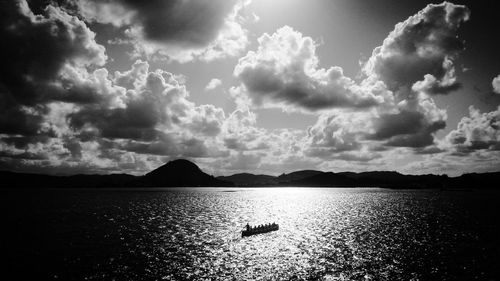 Scenic view of sea against cloudy sky