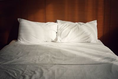 White sheet on bed at home