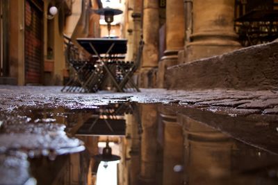 Reflection of building in puddle