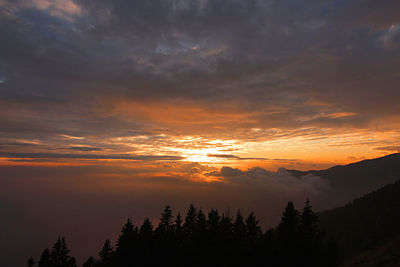 Scenic view of mountains against sky during sunset