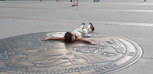 High angle view of woman lying down on floor