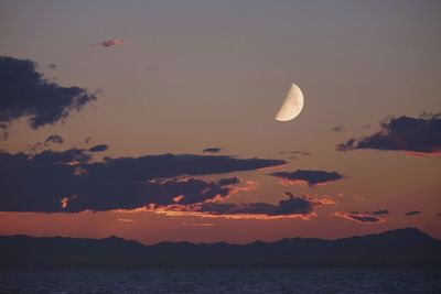 Scenic view of sea against sky at night