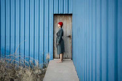 Man standing at entrance of building