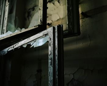 Broken window in abandoned house