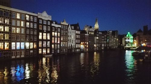 Illuminated buildings in city at night