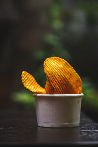 Close-up of orange juice on table