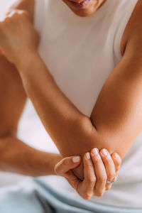 Elbow pain. woman with painful elbow.