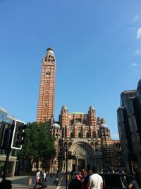 Low angle view of buildings against clear blue sky