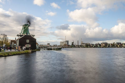 River amidst buildings against sky