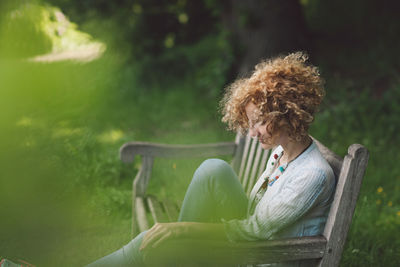 Woman sitting in park