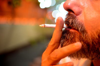 Close-up of man smoking cigarette