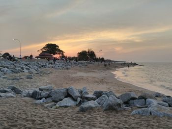 Scenic view of beach against sky during sunset