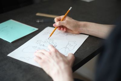 Close-up of human hand holding paper