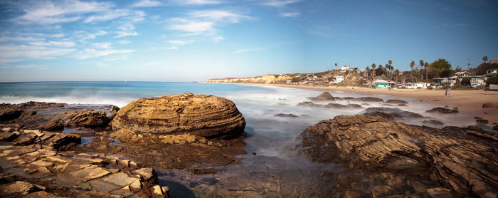 Scenic view of sea against blue sky