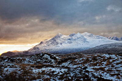 Scenic view of snowcapped mountains against sky