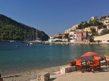 Calm sea with buildings in background